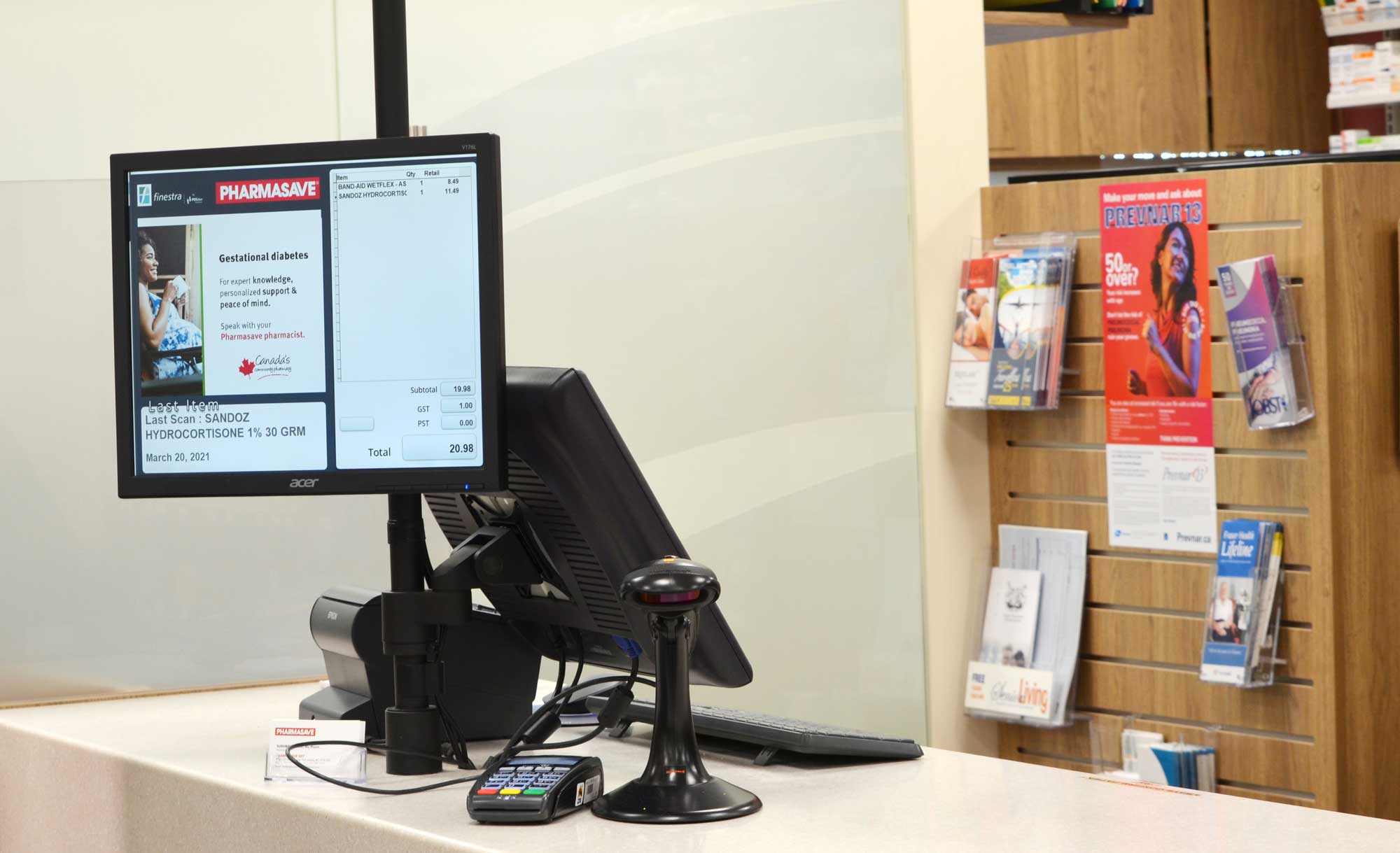 POS system sitting on a check out counter at a pharmasave pharmacy