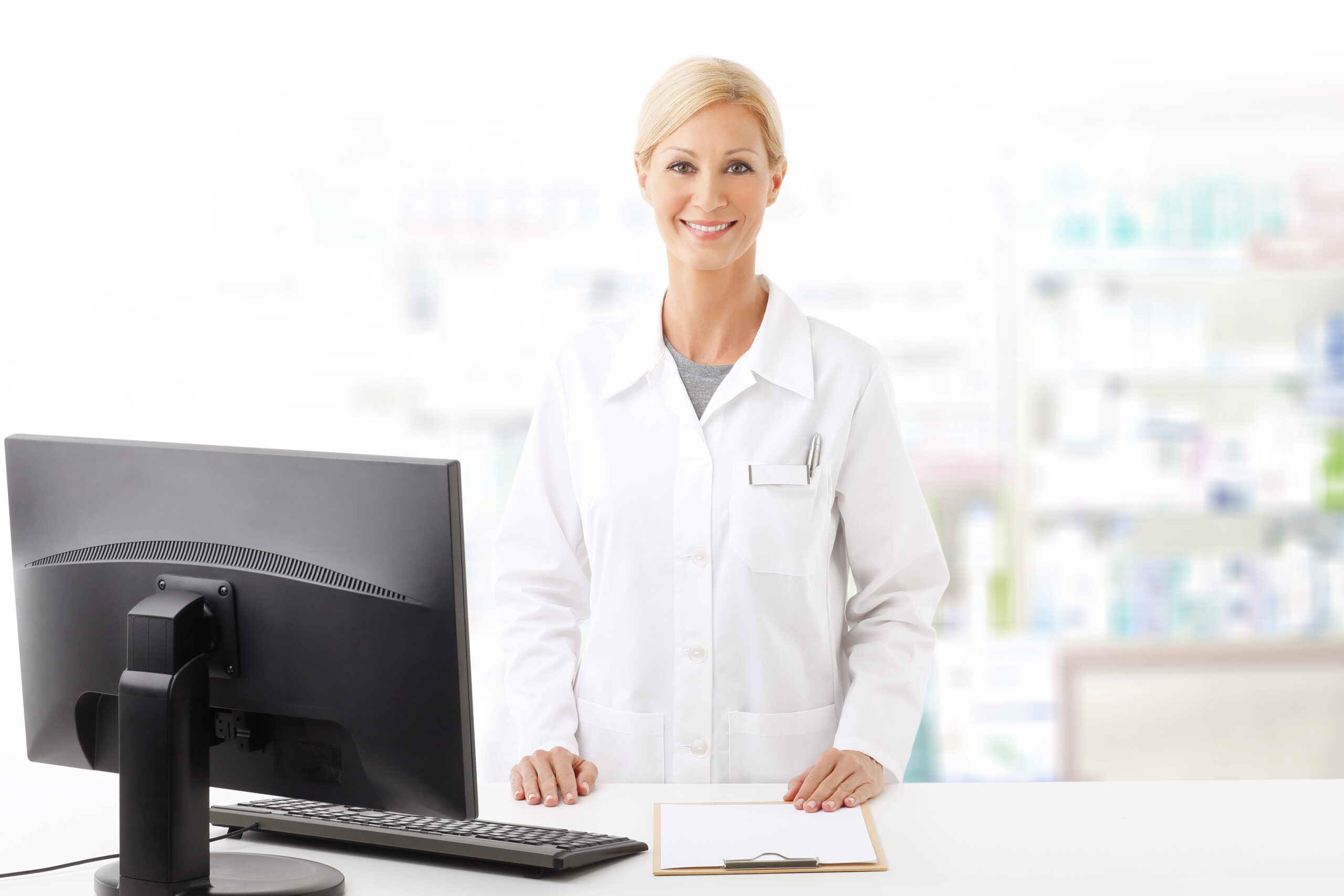 female pharmacy clerk at checkout smiling